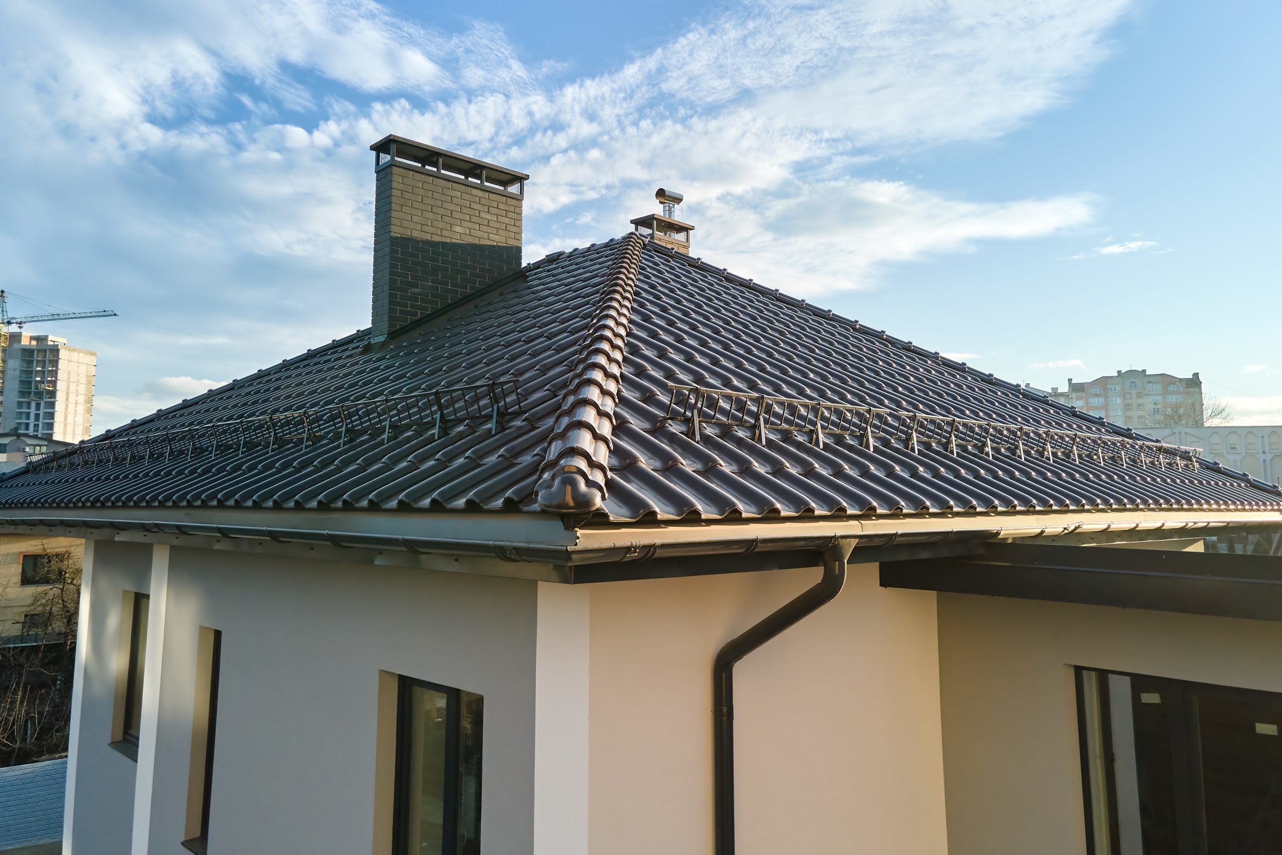 Closeup of House Roof Top Covering with Ceramic Shingles